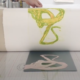 A print is pulled off the press